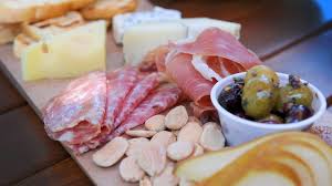 The Stonehaus signature dishes Margherita PizzaProsciutto & Burrata BoardTruffle Fries